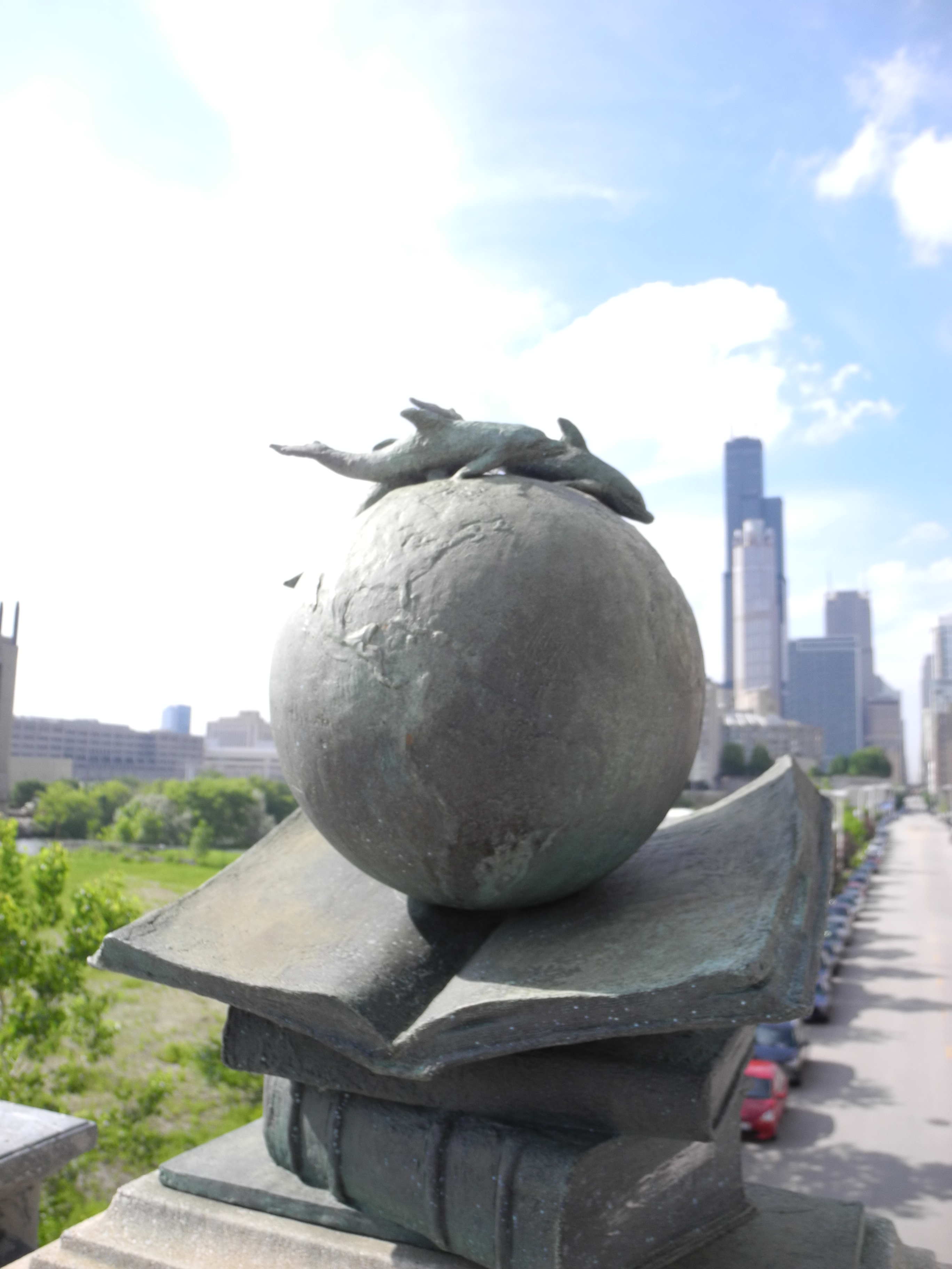 Walking back: globe on a bridge.  Hancock tower is in the background. That is the second tallest building in Chicago, and what we aim for when we're lost and need to get back to campus. 